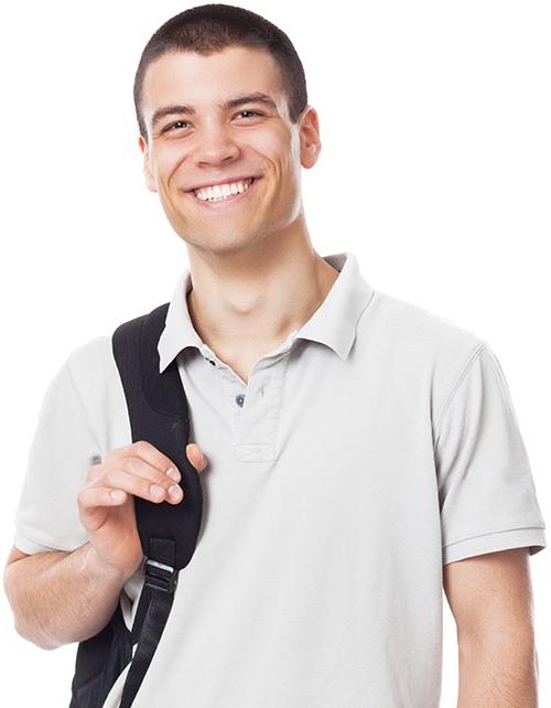 Male college student smiling holding a backpack